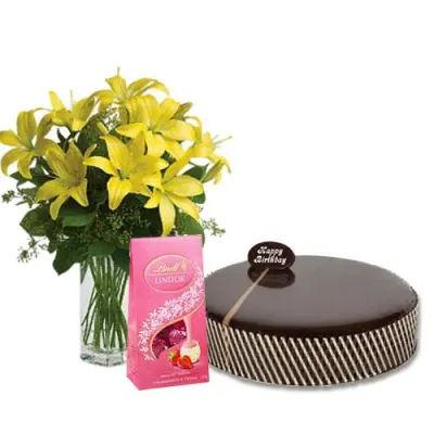 Mud Cake With Yellow Lilies And Lindt Chocolates