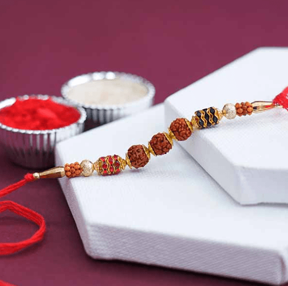 Graceful Layer Pearl Rakhi with Flavorful Kaju Katli - 500 Gm