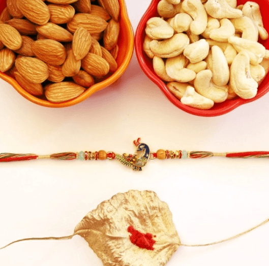 Majestic Peacock Rakhi Shine and Nutty Treats