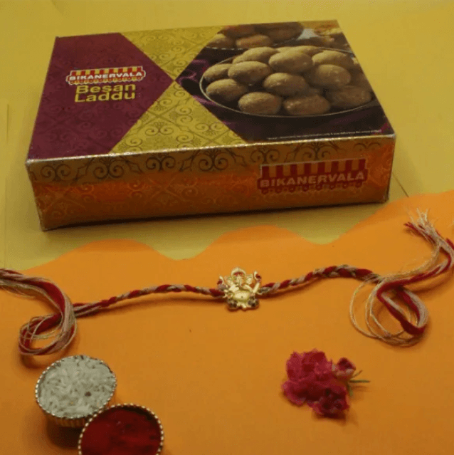 Divine Blessings Ganesha Rakhi with Sweet Laddu