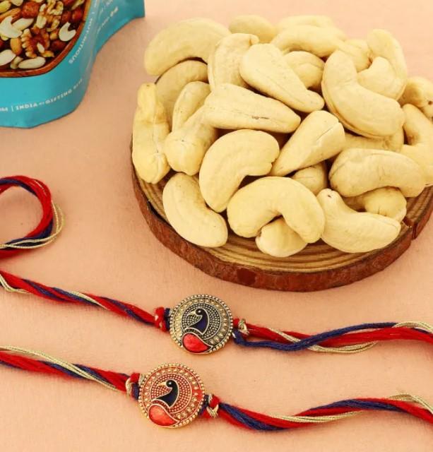 Peacock Charm Rakhi Duo with Nutty Delights