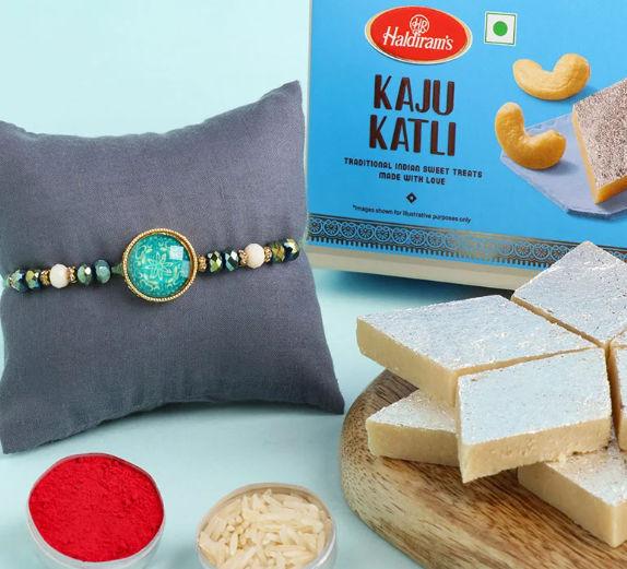 Charming Minty Rakhi With Tempting Kaju Katli