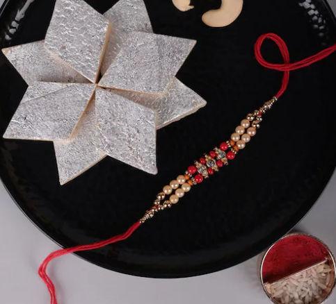 Trio of Rakhis with Delectable Soan Papdi and Ferrero Rocher