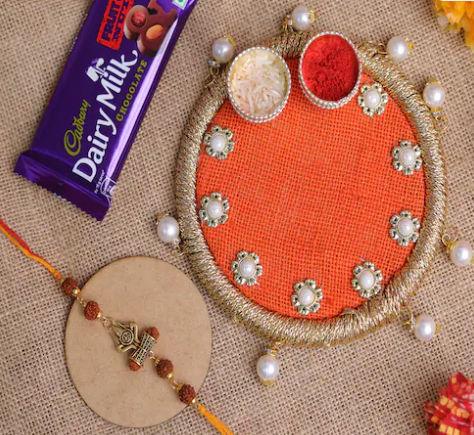 Sacred Damroo Rakhi with Divine Chocolate Combo