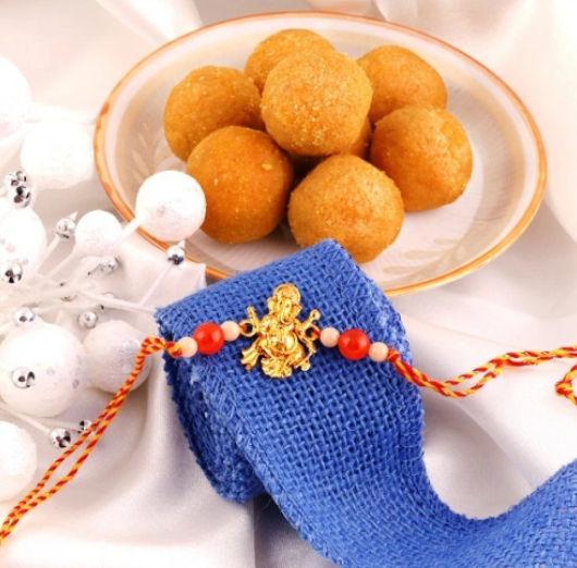 Sacred Ganpati Rakhi and Flavorful Laddoo