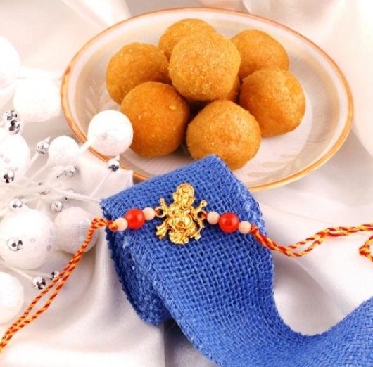 Sacred Ganpati Rakhi and Flavorful Laddoo